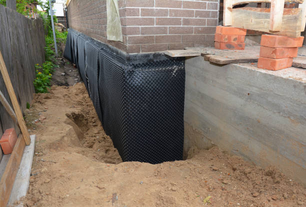 Happy homeowners after waterproofing job in Lawrence Township